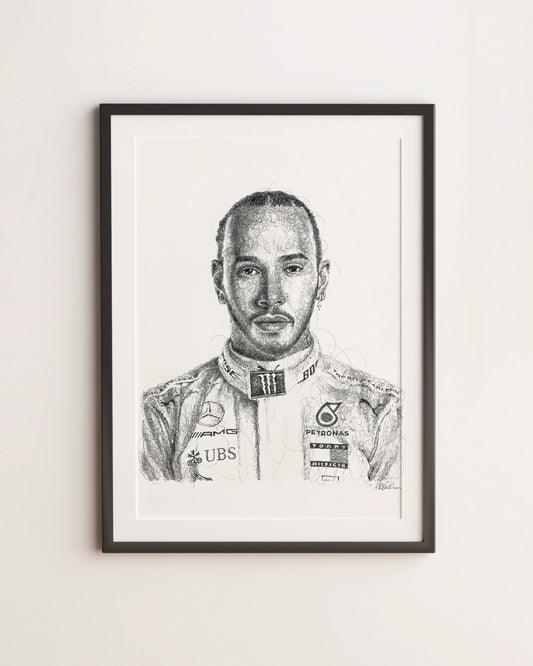 Framed black and white portrait of a Formula 1 driver Lewis Hamiltonn on a light gray wall